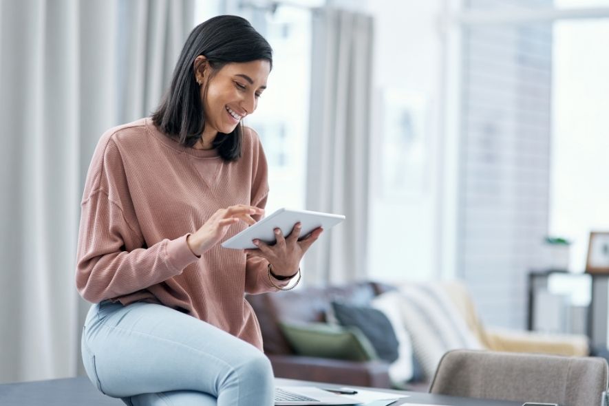 woman reading her tablet