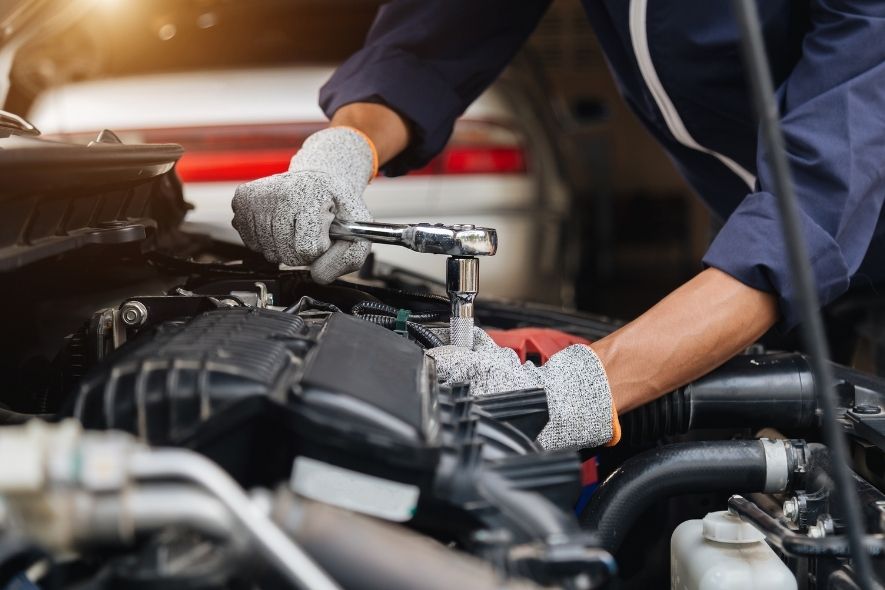 mechanic working on a car