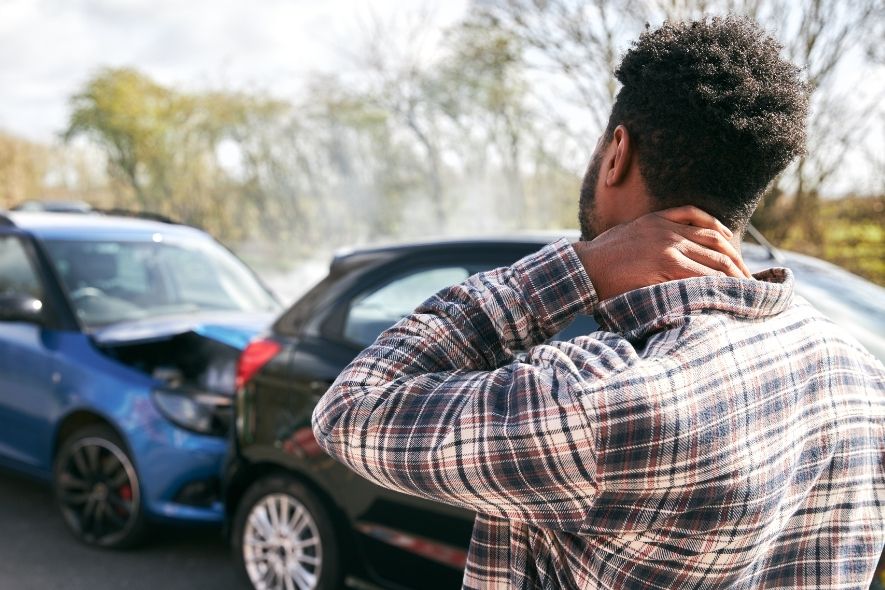 male looking at an accident