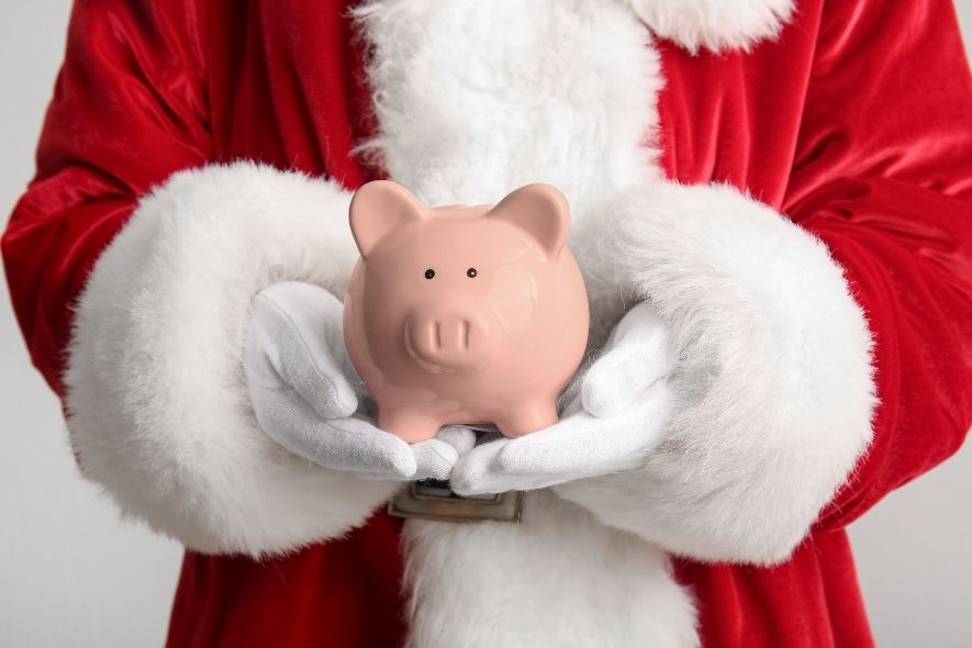 santa holding a piggy bank