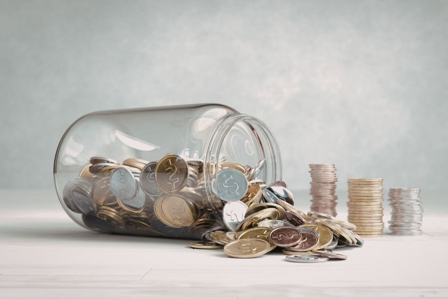tip over glass jar full of coins