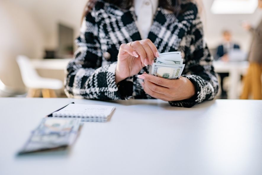 woman holding cash