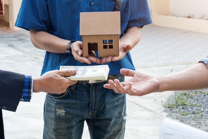 person buying a home. holding cash