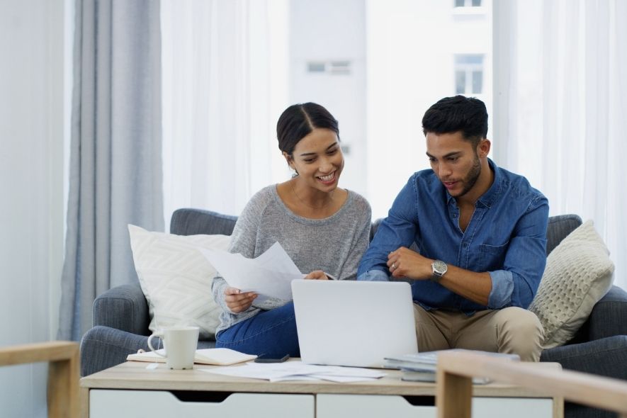 couple sitting in front of computer