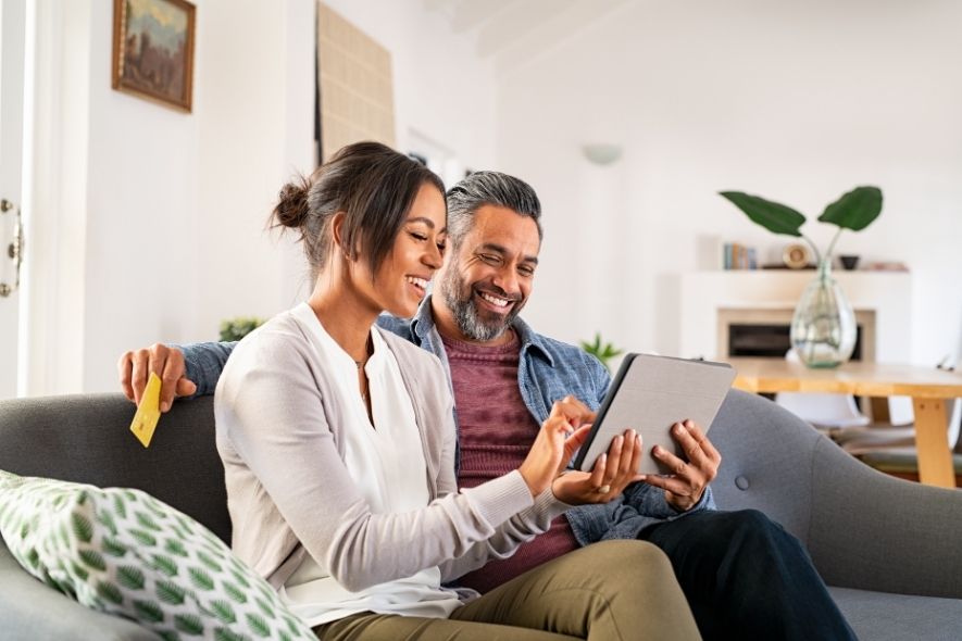 happy couple doing digital banking